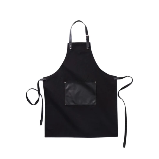 Stylish and classic apron in thick cotton canvas with discreet details in vegan leather. Adjustable buckle closure at the top and large pocket in the front. An apron with a long lifespan that only gets more beautiful with time. (VG019-03)-1
