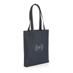 The Impact AWARE™ recycled denim tote 320gsm  is the perfect way to carry your essentials in style. This spacious tote provides sufficient space for your tech accessories and other daily needs. With AWARE™ tracer that validates the genuine use of rec-3