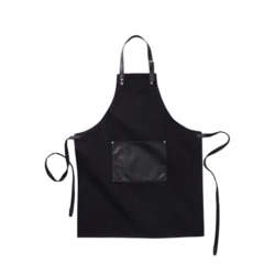Stylish and classic apron in thick cotton canvas with discreet details in vegan leather. Adjustable buckle closure at the top and large pocket in the front. An apron with a long lifespan that only gets more beautiful with time. (VG019-03)-5